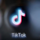 A blurred version of the logo of TikTok's app.
